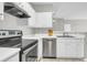 Kitchen featuring stainless steel appliances, white cabinets, a dishwasher, and ample counter space at 1600 Long Grove Dr # 423, Mount Pleasant, SC 29464