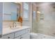 Modern bathroom with glass shower, light tile, and bright vanity at 1619 Cultivation Ln, Mount Pleasant, SC 29466