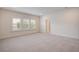 Bright bedroom with plush carpeting and large windows bringing in natural light to create an airy space at 1619 Cultivation Ln, Mount Pleasant, SC 29466