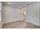 Light and airy bedroom features hardwood floors and bathroom access at 1619 Cultivation Ln, Mount Pleasant, SC 29466