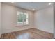 Bedroom features hardwood floors and a window providing natural light at 1619 Cultivation Ln, Mount Pleasant, SC 29466