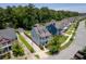 Aerial view of a charming home in a Gathering-friendly neighborhood surrounded by lush greenery at 1666 Sparkleberry Ln, Johns Island, SC 29455