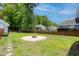 Expansive backyard featuring a stylish fire pit and lush green grass at 1666 Sparkleberry Ln, Johns Island, SC 29455