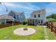 Spacious backyard with a fire pit, screened porch and outdoor seating, great for entertaining at 1666 Sparkleberry Ln, Johns Island, SC 29455