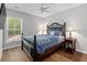Bedroom features a comfortable bed, natural light from the window, and simple decor at 1666 Sparkleberry Ln, Johns Island, SC 29455