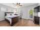 Large bedroom with a comfortable bed, natural light from multiple windows, and ceiling fan at 1666 Sparkleberry Ln, Johns Island, SC 29455