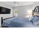 Bright bedroom with a comfortable bed, TV, and natural light from the window at 1666 Sparkleberry Ln, Johns Island, SC 29455