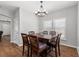 Cozy dining room featuring a chandelier and a wooden table set for six at 1666 Sparkleberry Ln, Johns Island, SC 29455