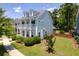 Charming home with a double porch and lush landscaping, nestled in a serene neighborhood setting at 1666 Sparkleberry Ln, Johns Island, SC 29455