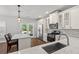 Well-equipped kitchen with stainless steel appliances, island seating, and a backyard view at 1666 Sparkleberry Ln, Johns Island, SC 29455