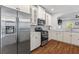 Modern kitchen with stainless steel appliances and white cabinets at 1666 Sparkleberry Ln, Johns Island, SC 29455