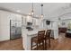 Bright and modern kitchen featuring stainless appliances, granite countertops, and island seating at 1666 Sparkleberry Ln, Johns Island, SC 29455