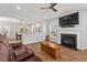 Comfortable living room featuring a fireplace and archway to the kitchen at 1666 Sparkleberry Ln, Johns Island, SC 29455