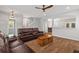 Spacious living room showcases wood floors and archways to the kitchen and foyer at 1666 Sparkleberry Ln, Johns Island, SC 29455