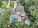 Aerial perspective of a home with a sparkling pool, outdoor seating, and beautifully landscaped surroundings at 1728 Wellstead St, Mount Pleasant, SC 29466