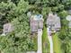 Expansive aerial view of a residential property showcasing the home, pool, and surrounding lush greenery at 1728 Wellstead St, Mount Pleasant, SC 29466