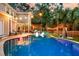 Stunning backyard featuring a large pool, patio area, and lush greenery at 1728 Wellstead St, Mount Pleasant, SC 29466