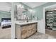 Bathroom with a modern rustic vanity, double sinks, and stylish fixtures, located next to closet and bedroom at 1728 Wellstead St, Mount Pleasant, SC 29466