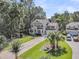 Spacious two-story home with a welcoming porch, well-manicured lawn, and ample parking space at 1728 Wellstead St, Mount Pleasant, SC 29466