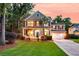 Charming home with a front porch, two-car garage, and lovely lawn at 1728 Wellstead St, Mount Pleasant, SC 29466