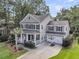Elegant two-story home with a cozy front porch, lush lawn, and a convenient two-car garage at 1728 Wellstead St, Mount Pleasant, SC 29466