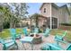 Inviting backyard fire pit with Adirondack chairs and patio area, perfect for outdoor entertaining at 1728 Wellstead St, Mount Pleasant, SC 29466