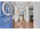 Elegant foyer with hardwood floors, archways, and a glimpse into the living room with a fireplace at 1728 Wellstead St, Mount Pleasant, SC 29466