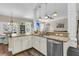 Kitchen with white cabinets, granite countertops, stainless appliances, and dining area at 1728 Wellstead St, Mount Pleasant, SC 29466