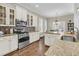 Spacious kitchen with stainless appliances, granite counters, and white cabinets at 1728 Wellstead St, Mount Pleasant, SC 29466