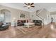 Cozy living room with fireplace, ceiling fan, and staircase leading to the second floor at 1728 Wellstead St, Mount Pleasant, SC 29466