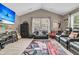 Home theater room offers vaulted ceilings, large screen TV, leather recliners and movie-themed decor for immersive viewing at 1728 Wellstead St, Mount Pleasant, SC 29466