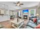 Spacious living room featuring a fireplace, large windows, and seamless flow into the dining area at 1728 Wellstead St, Mount Pleasant, SC 29466