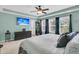Main bedroom with neutral tones, a ceiling fan, and large windows providing natural light at 1728 Wellstead St, Mount Pleasant, SC 29466