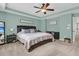 Comfortable main bedroom with soft carpet, tray ceilings, ample natural light, and modern decor at 1728 Wellstead St, Mount Pleasant, SC 29466