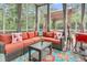 Cozy screened-in patio with comfortable seating and stylish decor; perfect for outdoor relaxation at 1728 Wellstead St, Mount Pleasant, SC 29466