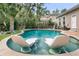 Inviting pool with in-water lounge chairs and landscaped backyard, perfect for relaxation and recreation at 1728 Wellstead St, Mount Pleasant, SC 29466