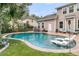 Stunning in-ground pool surrounded by lush landscaping, lounge chairs and patio area at 1728 Wellstead St, Mount Pleasant, SC 29466