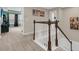 Traditional stairway with white spindles and a dark wood handrail leading to the second story of the home at 1728 Wellstead St, Mount Pleasant, SC 29466