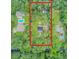 Amazing aerial view of a house and yard outlined in red, surrounded by beautiful green trees at 196 Dogwood Ridge Rd, Summerville, SC 29485