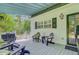 Relaxing back porch with comfortable seating and wooded backyard views at 196 Dogwood Ridge Rd, Summerville, SC 29485