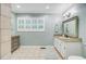 Bright bathroom with vanity, granite countertops, decorative mirror, and natural light at 196 Dogwood Ridge Rd, Summerville, SC 29485