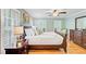 Cozy bedroom features a ceiling fan, wood floors, and plenty of natural light at 196 Dogwood Ridge Rd, Summerville, SC 29485