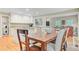 Open-concept dining area showcases hardwood floors and seamless flow into the modern kitchen and adjacent living spaces at 196 Dogwood Ridge Rd, Summerville, SC 29485