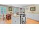 Open-concept kitchen and dining area with granite counters, stainless steel appliances and hardwood flooring at 196 Dogwood Ridge Rd, Summerville, SC 29485