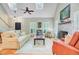 Bright living room with vaulted ceiling, brick fireplace, hardwood floors, and large windows at 196 Dogwood Ridge Rd, Summerville, SC 29485