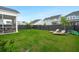 Spacious backyard features a screened-in porch, privacy fence, and green lawn at 198 Steepbrook Dr, Summerville, SC 29486