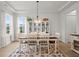 Bright dining room with large windows and stylish chandelier at 198 Steepbrook Dr, Summerville, SC 29486