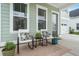 Inviting front porch with chairs and a table perfect for relaxation at 198 Steepbrook Dr, Summerville, SC 29486