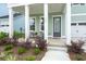 Inviting front porch with chairs and a table for relaxing at 198 Steepbrook Dr, Summerville, SC 29486