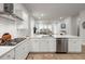Spacious open kitchen with white cabinets, stainless steel appliances, and access to the living room at 198 Steepbrook Dr, Summerville, SC 29486